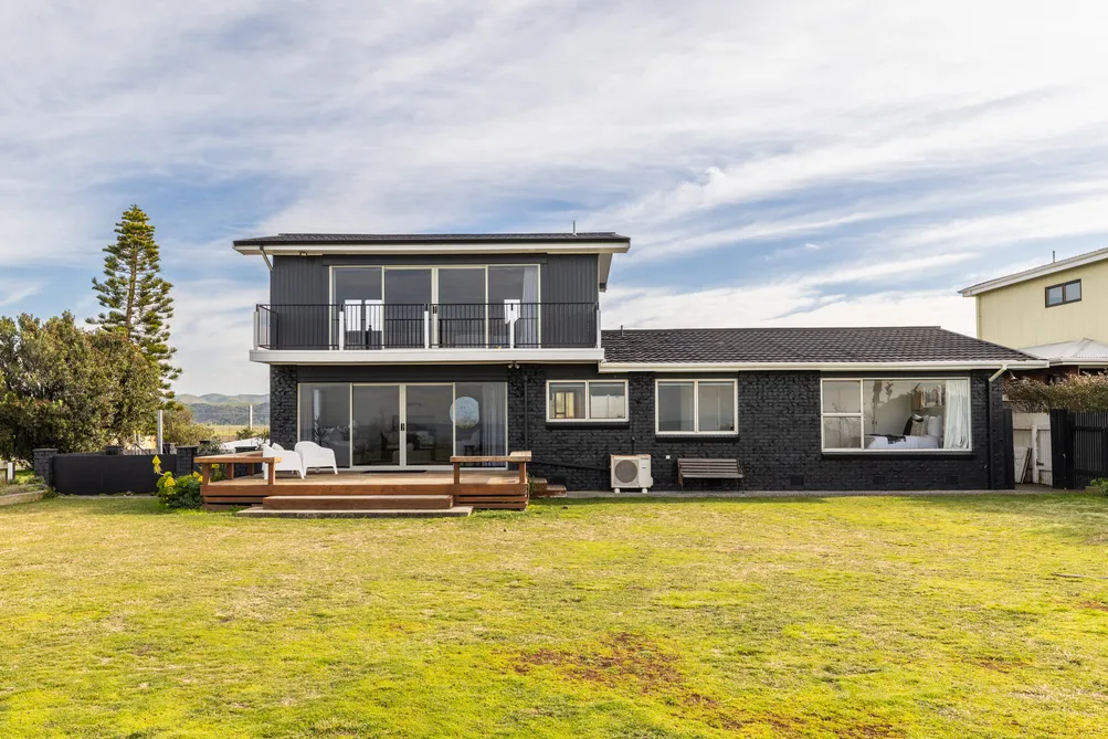 Absolute Beachfront Living with Potential