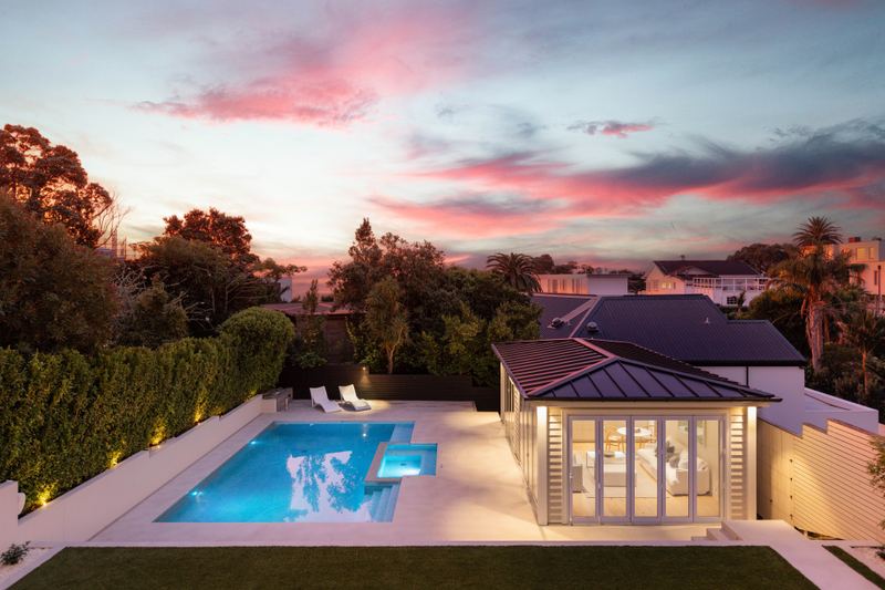 Aerial view of the pool and pool house at dusk, 20 Springcombe Road, St Heliers